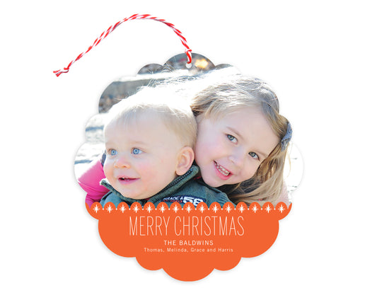 Front of customizable paper holiday ornament card featuring a photo with a red sparkle border, “Merry Christmas” text and a personal message. Round ornament with scalloped edges.