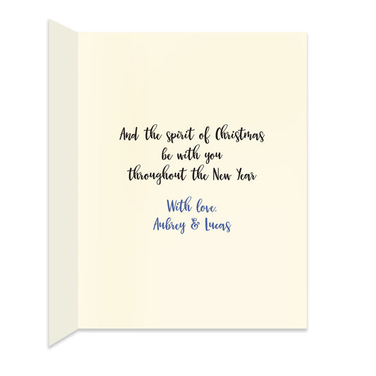 Inside of folded holiday card with personal greeting in coordinating black and blue colors.