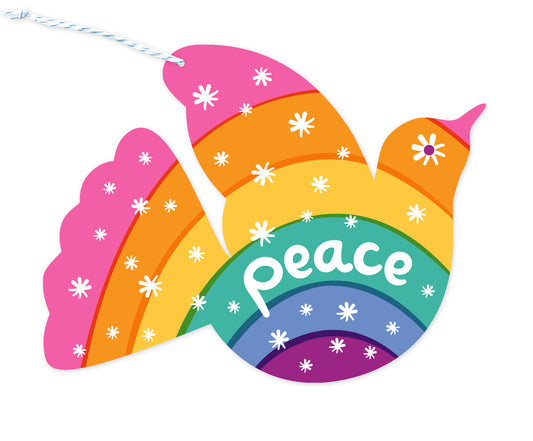 Front of dove-shaped paper personalized holiday ornament card with 'Peace' text and a star pattern on a pastel rainbow background.