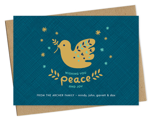 Customizable paper holiday card featuring a gold dove carrying an olive branch, “Wishing You Peace and Joy” text and a personal greeting on a blue crosshatch patterned background. Shown with a kraft envelope.