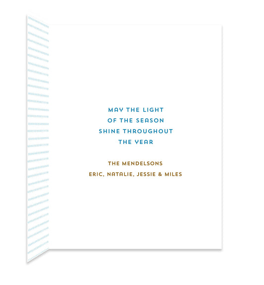 Inside of folded holiday card with coordinating small blue dots and a personal greeting.