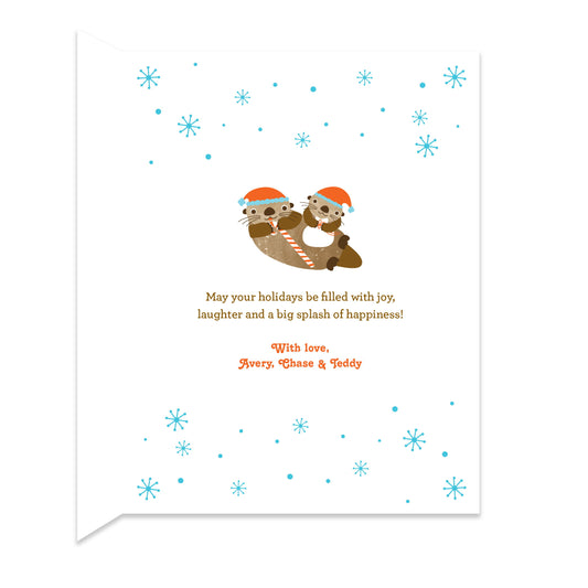 Inside of folded holiday card with coordinating snowflake and otter family design and personal greeting.