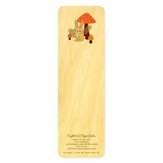 Back side of wooden bookmark with cartoon rabbit and mushroom design