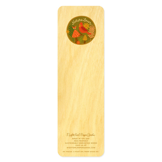 Back side of wooden bookmark with red bird, flowers, butterfly and mushrooms in a circle that reads 'Nature Lover' in script handwriting