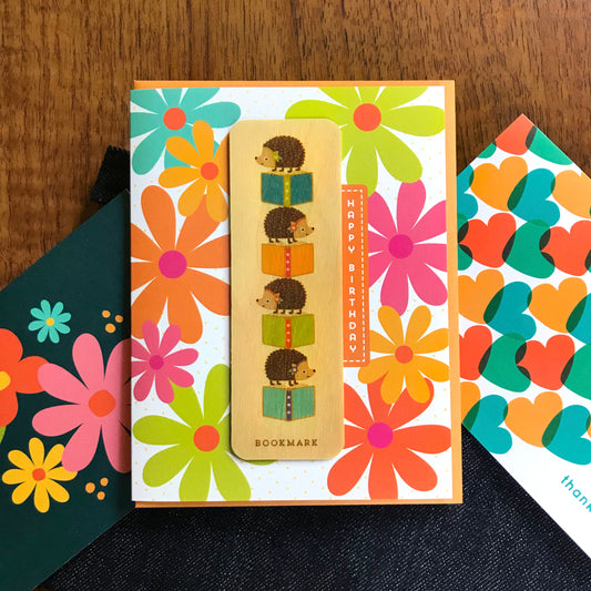 Reading Hedgehog Bookmark Birthday Card featured alongside colorful thank you cards with flowers and hearts.