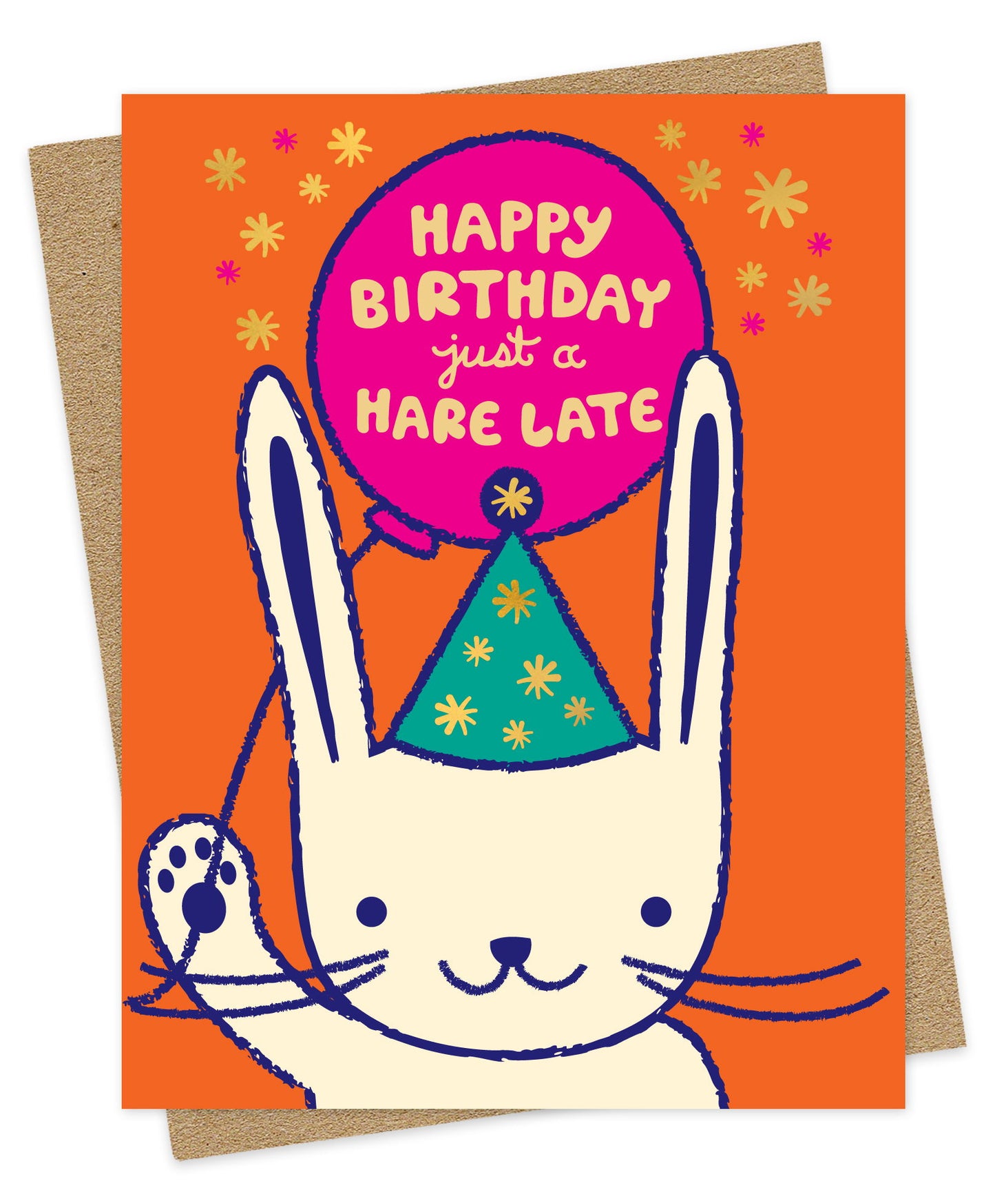 Belated birthday greeting card featuring a white bunny rabbit illustration, “Happy Birthday Just a Hare Late” message and gold foil accents on an orange background. Shown with a kraft envelope.