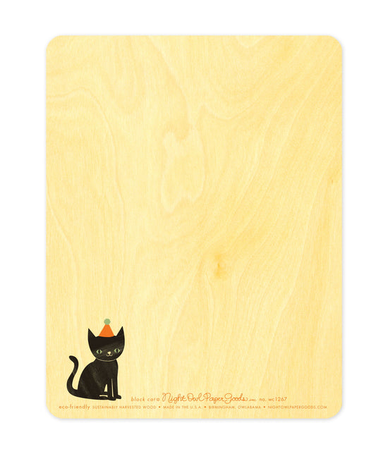 Back of Black Cat wood birthday card, which features a small black cat wearing a party hat in the lower left corner and space to write a personal greeting. Along the bottom is the company logo and text that reads "eco-friendly sustainably harvested wood - made in the usa - birmingham, owlabama - nightowlpapergoods.com"