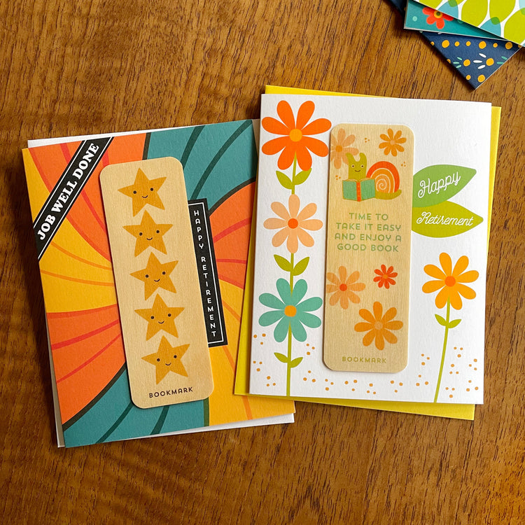 Two retirement greeting cards with removable wood bookmarks. Swirl pattern with 5 stars with happy face bookmark and take it easy snail bookmark