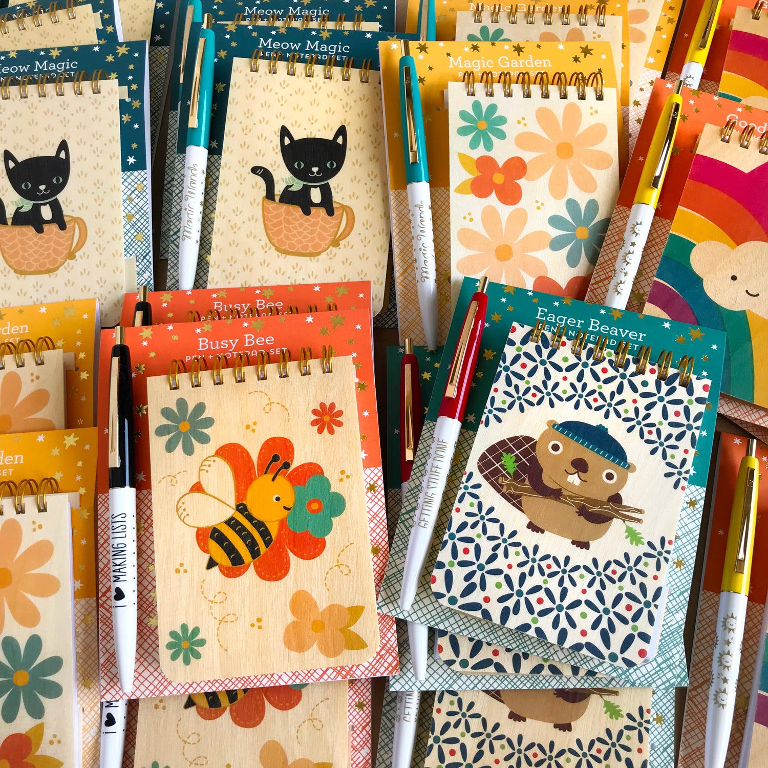 Gift-ready wood notepad and pen set with bright, fun rainbow and sun designs