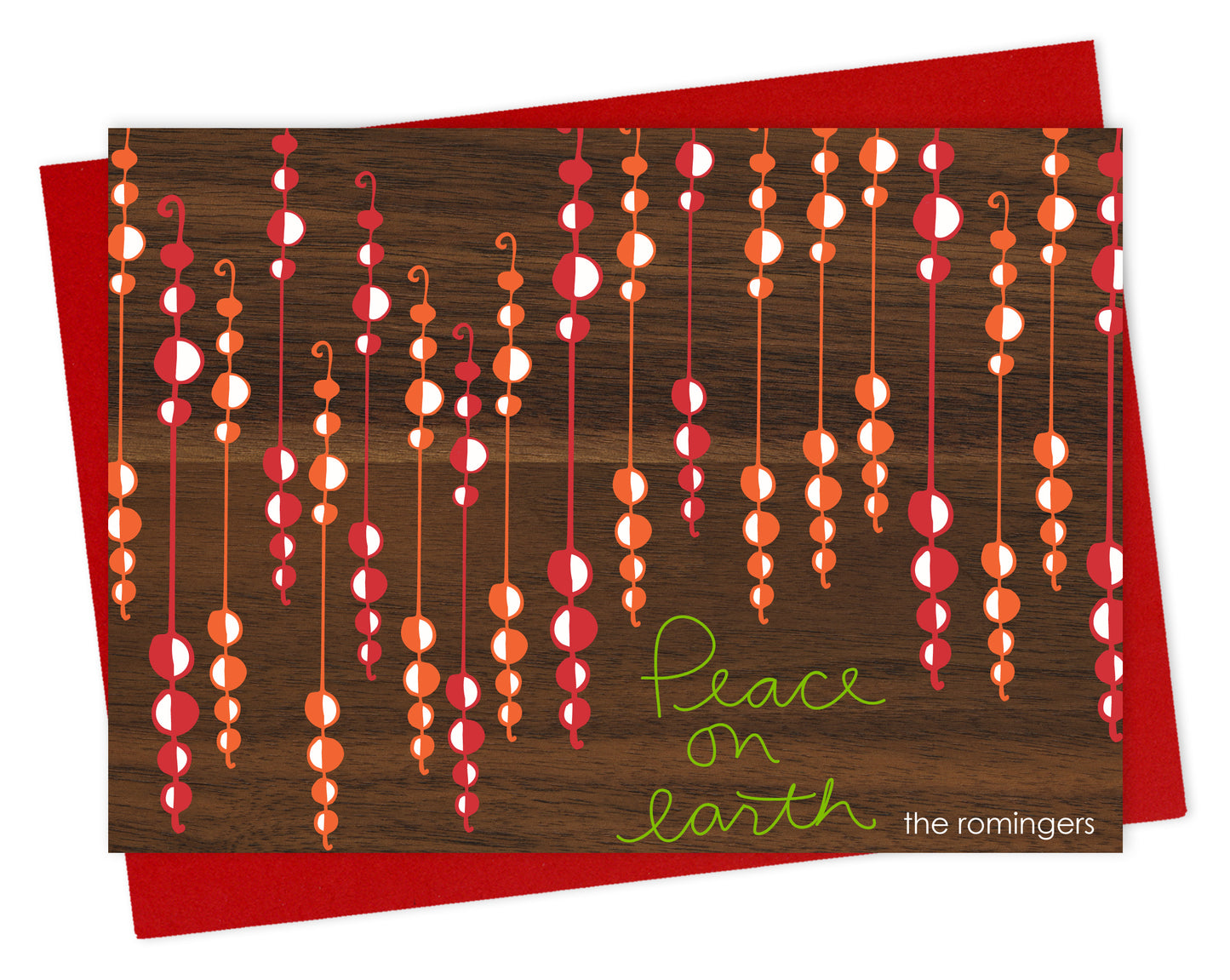 Customizable paper holiday card featuring festive beaded garlands with “Peace on Earth” text on a printed walnut wood grain background. Shown with a red envelope.