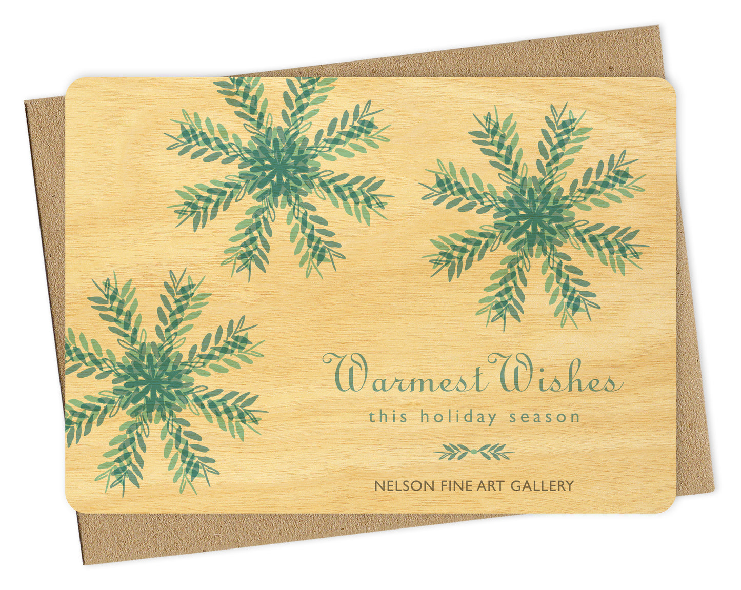 Customizable wood holiday card featuring blue snowflakes on a birch wood background with space for a logo and/or personal message. Shown with a kraft envelope.