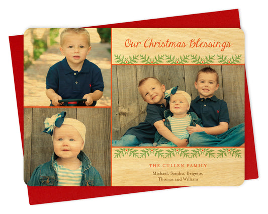 Customizable wood holiday card with three photos bordered by birch wood, festive garland and a personal greeting. Shown with a red envelope.