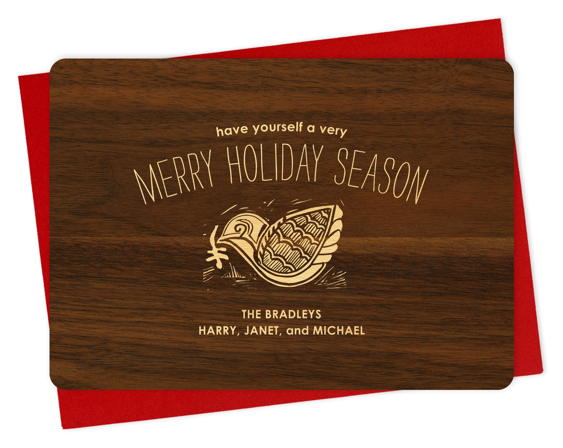 Customizable wood holiday card with a knock-out style dove, “Have Yourself a Merry Holiday Season” text and a personal message on a printed walnut wood grain background. Shown with a red envelope.