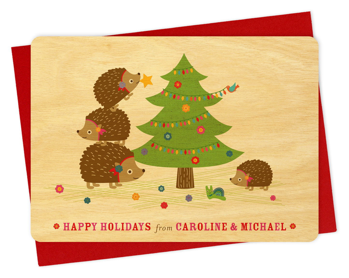 Customizable birch wood Christmas card with hedgehogs and a decorated tree, "Happy Holidays" text and personal message. Show with a red envelope. 