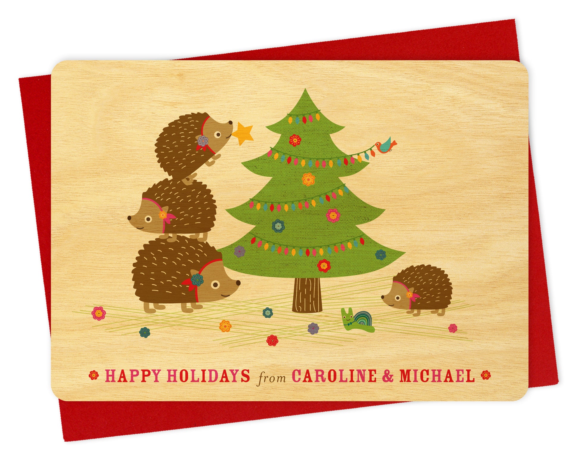 Customizable birch wood Christmas card with hedgehogs and a decorated tree, "Happy Holidays" text and personal message. Show with a red envelope. 