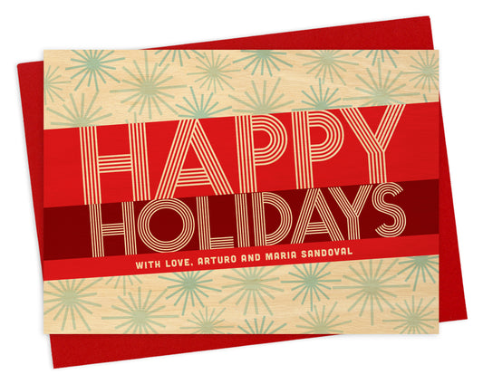 Customizable paper holiday card featuring a bold red banner with "Happy Holidays" text and a personal greeting on a snowflake-covered printed birch wood grain background. Shown with a red envelope.