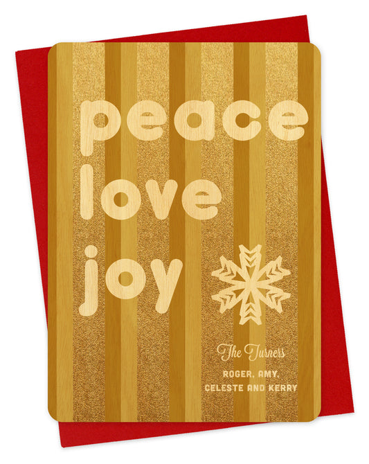 Customizable birch wood holiday card featuring glittering gold vertical stripes, a snowflake, a “Peace Love Joy” message and a personal greeting. Shown with a red envelope.