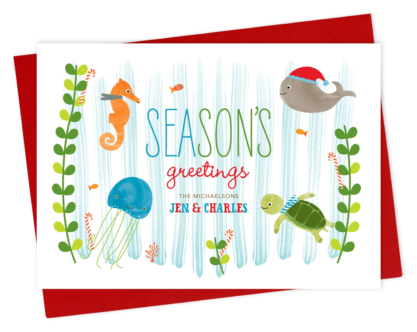 Front of personalized paper holiday card with cute marine sea creatures, "Season's Greetings" text and a personalized message on a white background. Shown with a red envelope. 