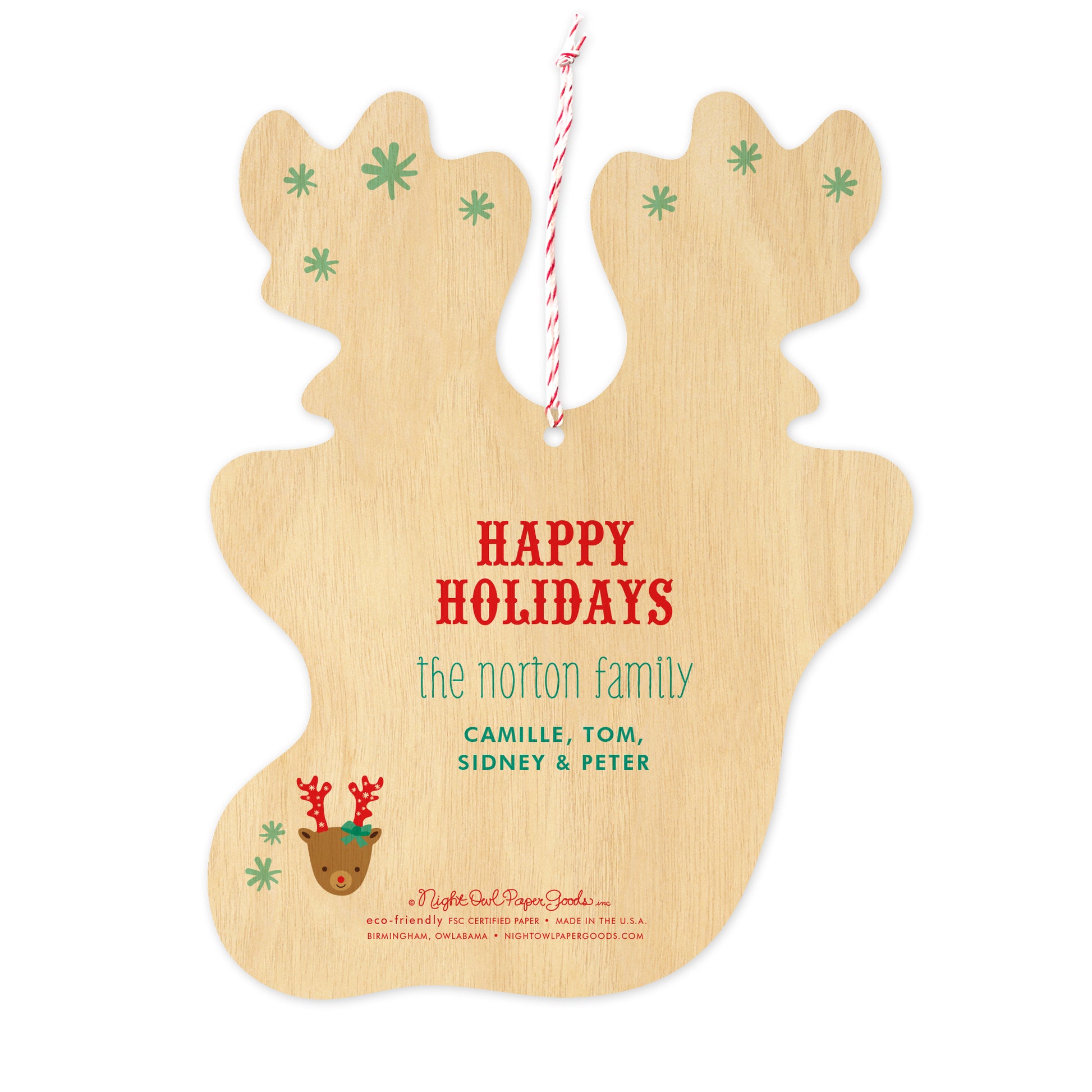 Back of customizable paper holiday ornament card features sentiment 'Happy Holidays' and personalized names. Flat ornament is the shape of reindeer head with antlers and comes with red and white twine. Paper is printed to look like wood.