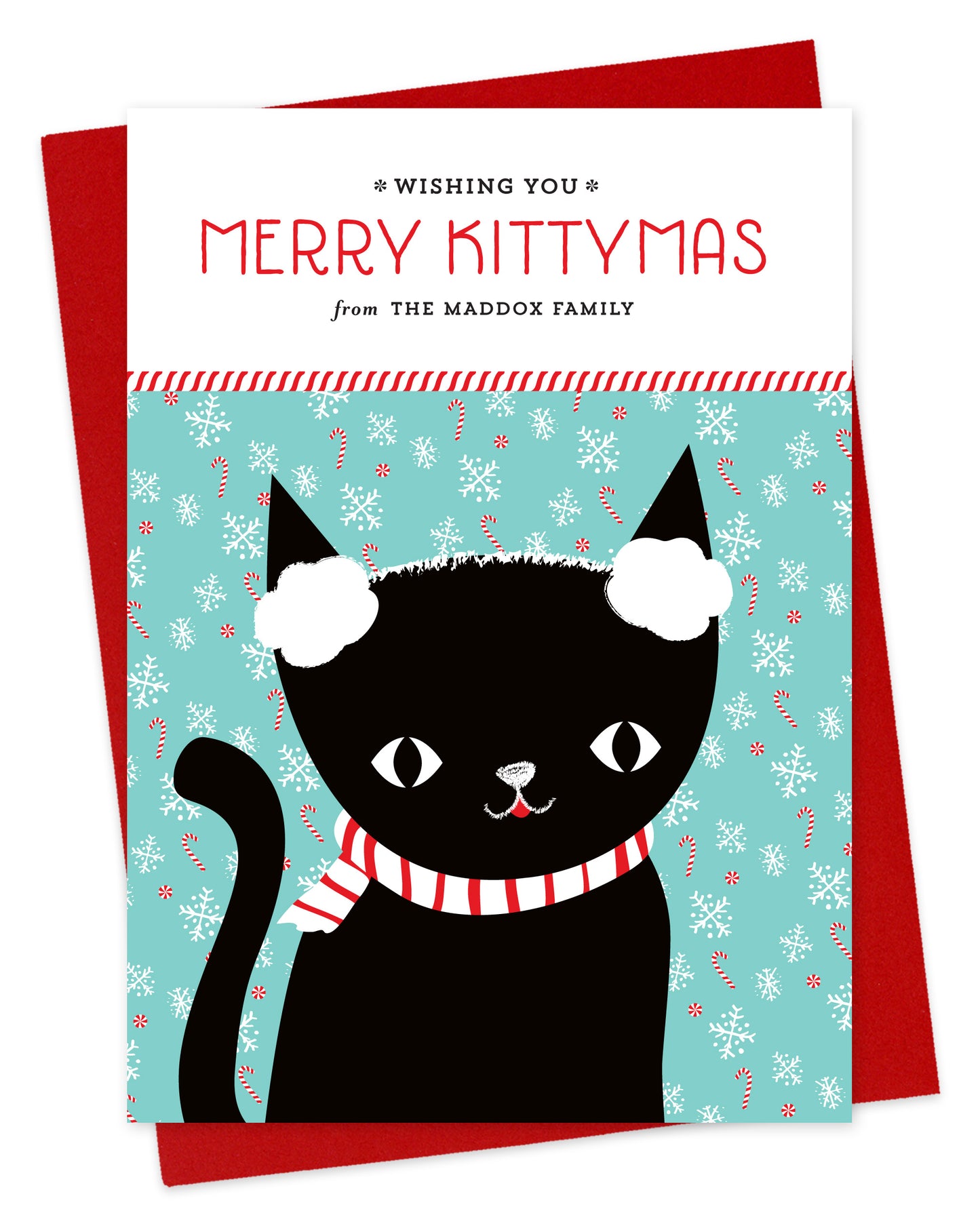 Customizable paper holiday card featuring a black cat wearing earmuffs in front of a festive backdrop, a "Merry Kittymas" sentiment and a personal greeting. Shown with a red envelope.