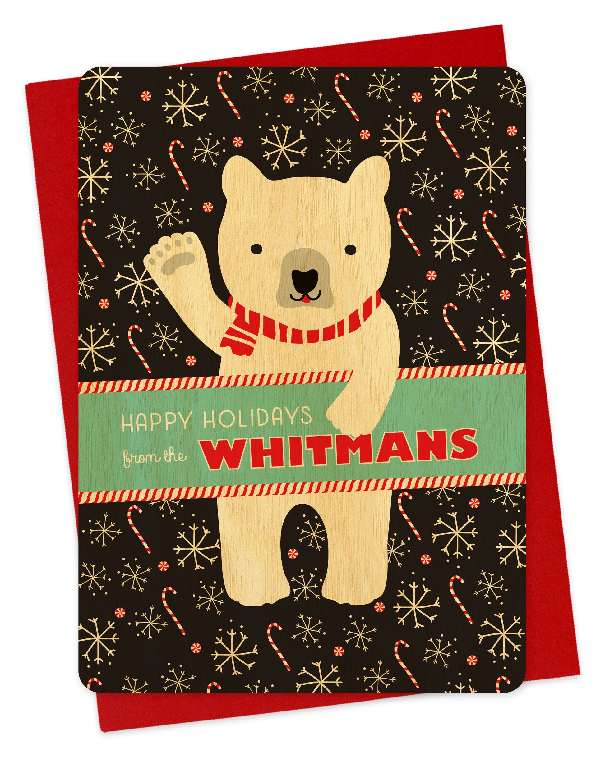 Customizable birch wood holiday card featuring a cheerful polar bear wearing a scarf and waving “Happy Holidays” against a black backdrop with candy canes and snowflakes. A banner across the middle displays a personal greeting. Shown with a red envelope.
