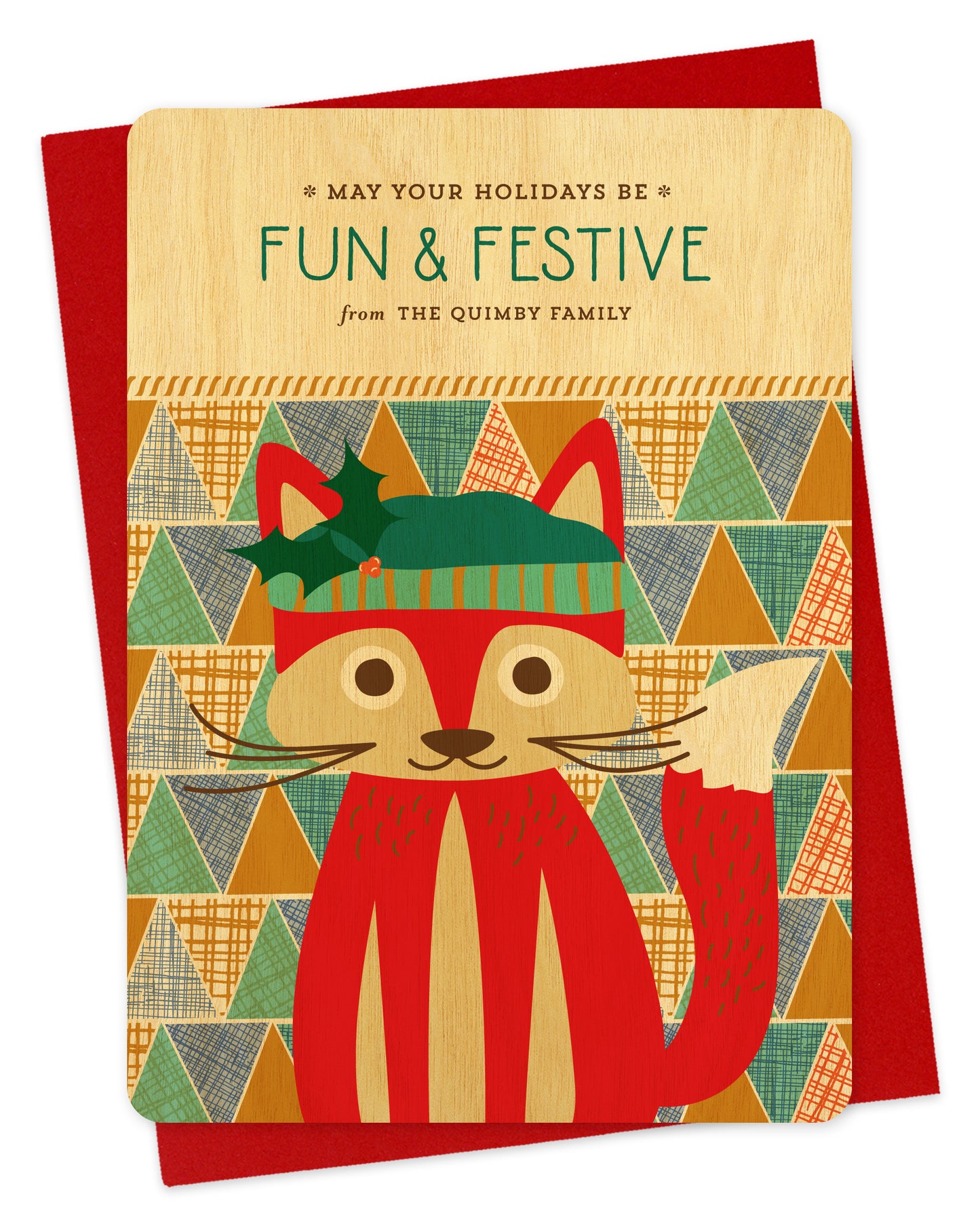 Customizable birch wood holiday card featuring a cute red fox wearing a stocking cap, “May Your Holidays Be Fun & Festive” text and a personal greeting on a colorful, geometric patchwork background. Shown with a red envelope.
