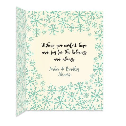 Inside of folded holiday card with coordinating snowflake pattern and personal greeting.