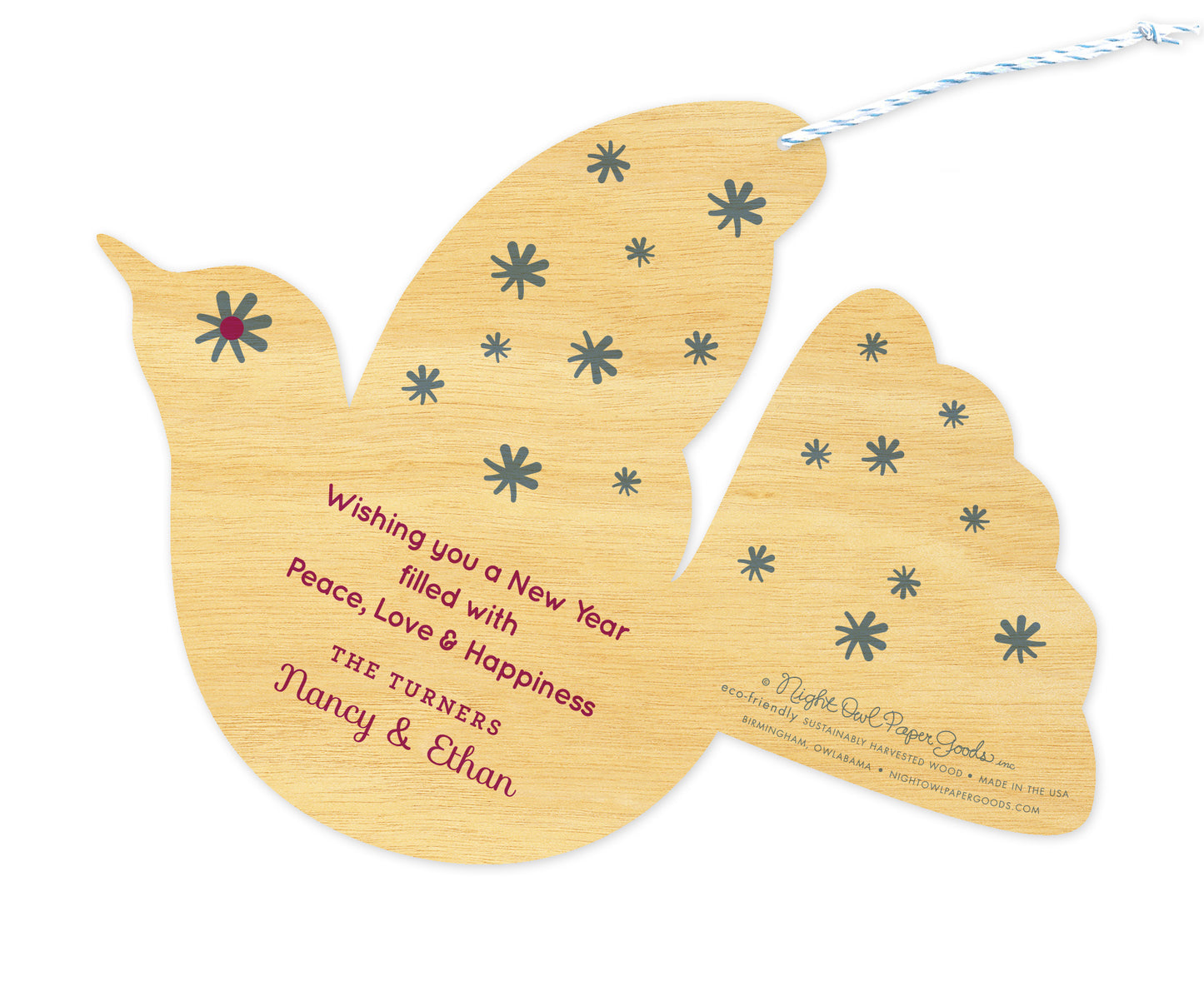 Back of personalized dove-shaped birch wood holiday ornament card with a personal greeting and a star pattern.