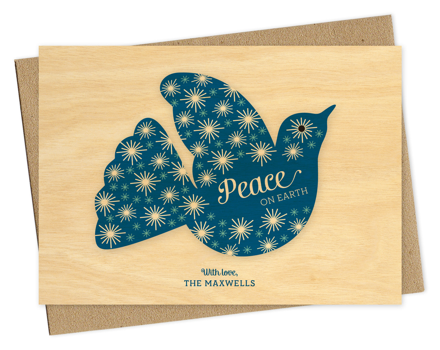 Customizable paper holiday card with blue dove, “Peace on Earth” sentiment, personal greeting and printed birch wood grain background. Shown with a kraft envelope.