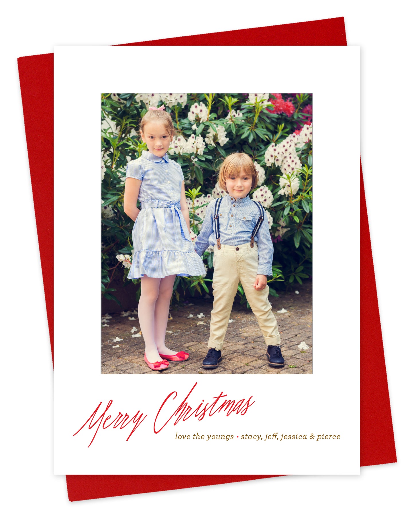 Customizable paper holiday card featuring your photo with a white border and "Merry Christmas" script text near the bottom. Shown with a red envelope.
