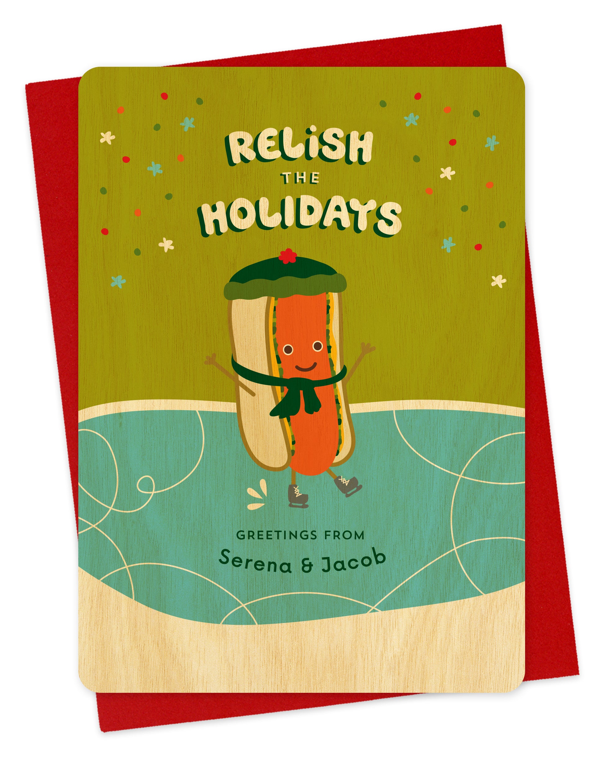 Customizable birch wood holiday card featuring a cheerful ice skating hot dog, a "Relish the Holidays" sentiment and a personal greeting. Shown with a red envelope.
