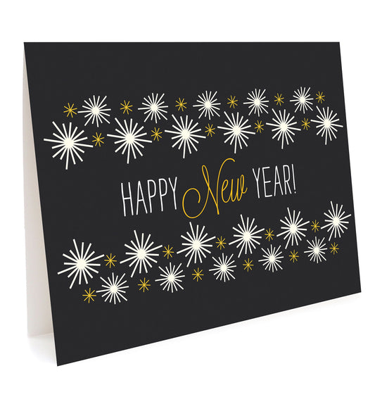 Front of folded holiday card featuring a bold black background with festive white and gold starbursts and "Happy New Year" text.