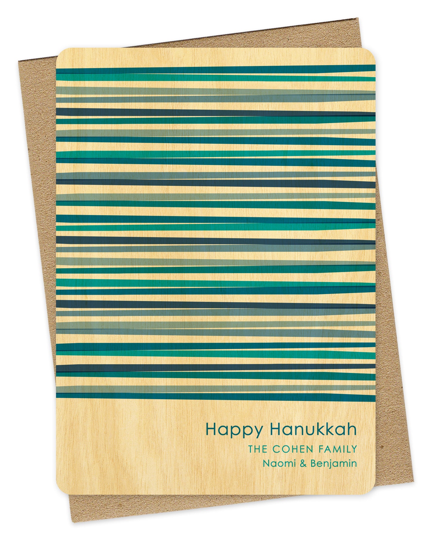 Customizable wood Hanukkah card featuring vibrant blue interwoven stripes, “Happy Hanukkah” text and a personal greeting on a birch wood background. Shown with a kraft envelope.