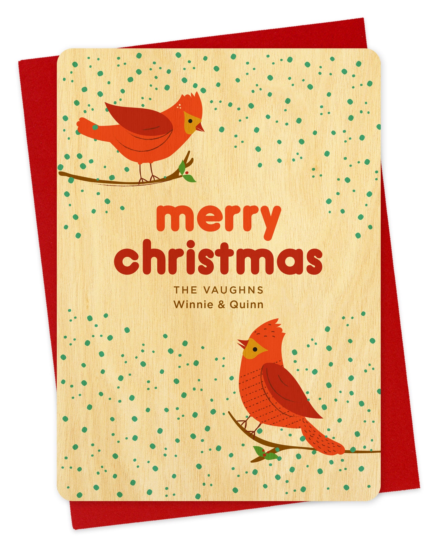 Customizable birch wood Christmas card featuring two red cardinals perched against a snowy background with “Merry Christmas” text and a personal greeting. Shown with a red envelope.