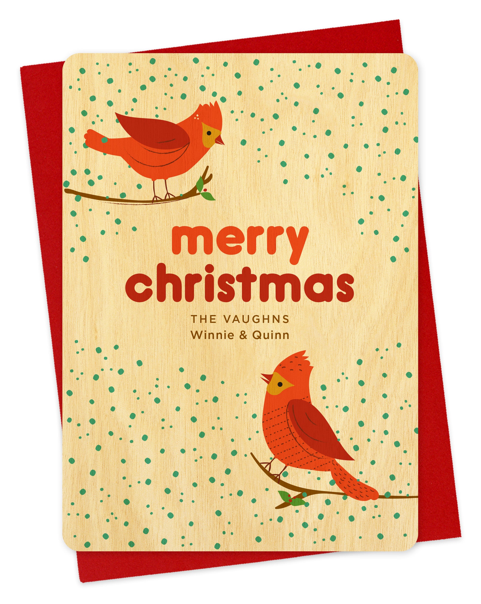 Customizable birch wood Christmas card featuring two red cardinals perched against a snowy background with “Merry Christmas” text and a personal greeting. Shown with a red envelope.