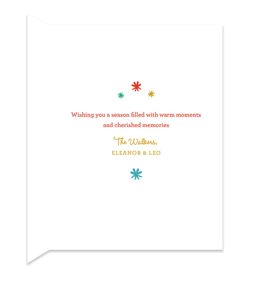 Inside of folded holiday card with coordinating color stars and a personal greeting.