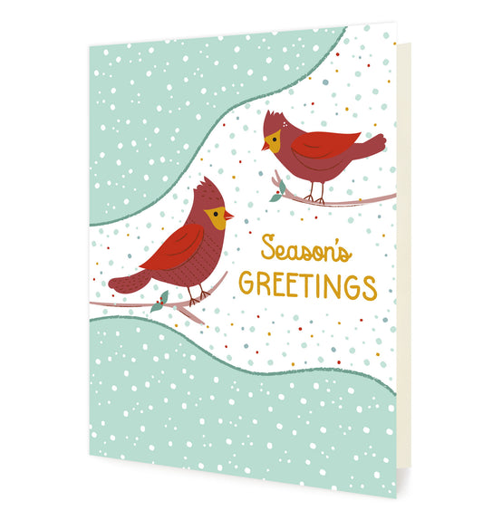 Front of folded card with two cute red birds in a snowy nature scene with “Season’s Greetings” text. 