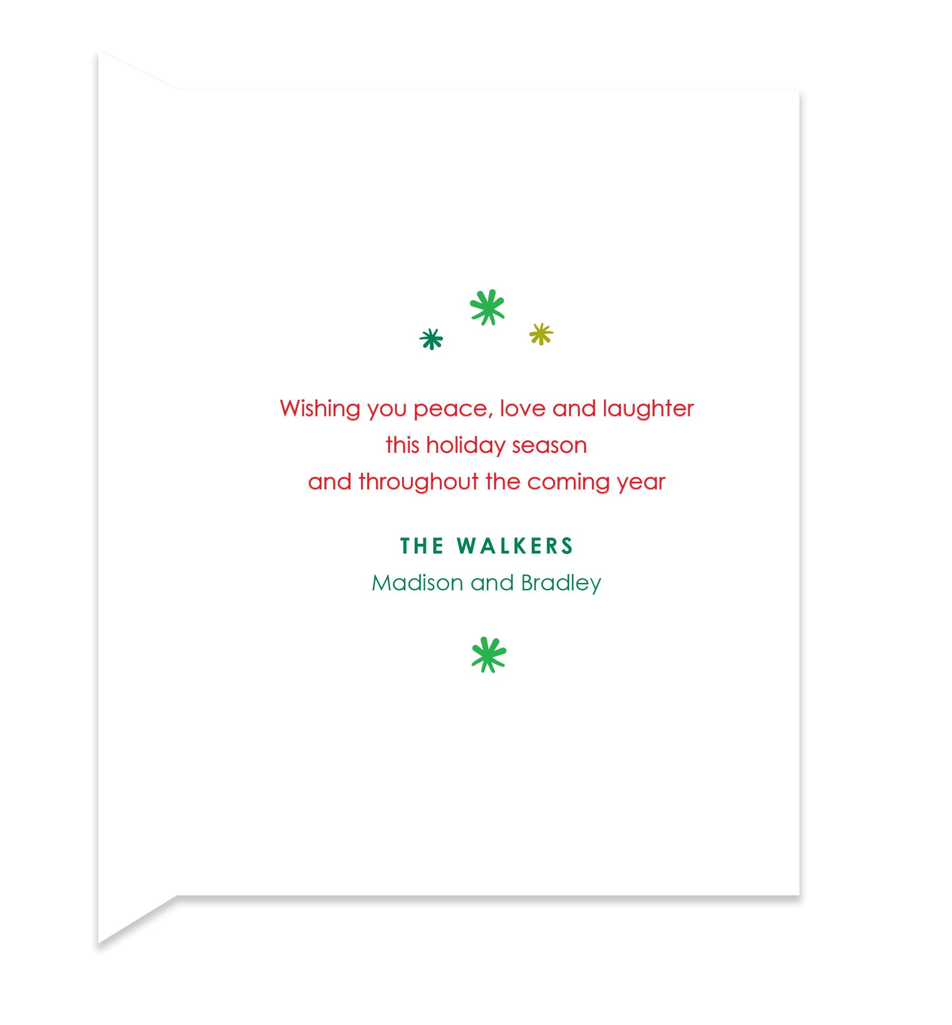 Inside of folded holiday card with coordinating green starbursts and a personal greeting.