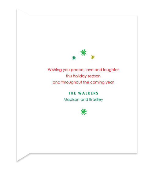 Inside of folded holiday card with coordinating green starbursts and a personal greeting.