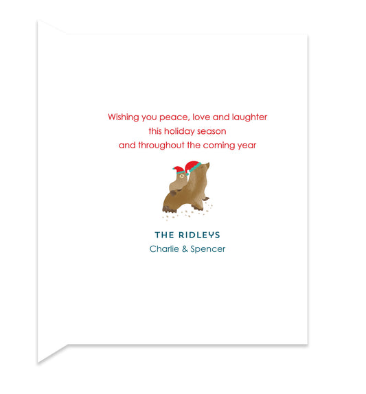 Inside of folded holiday card with coordinating sea lion design and personal greeting.