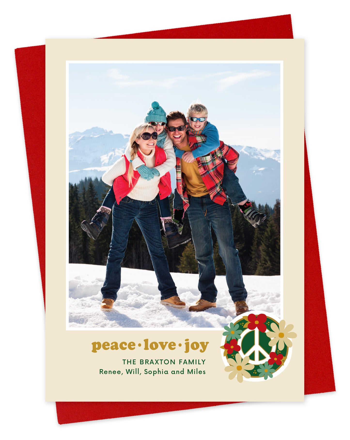 Customizable paper holiday card featuring a family photo with “peace love joy” text and a peace sign surrounded by flowers near the bottom, shown with a red envelope.