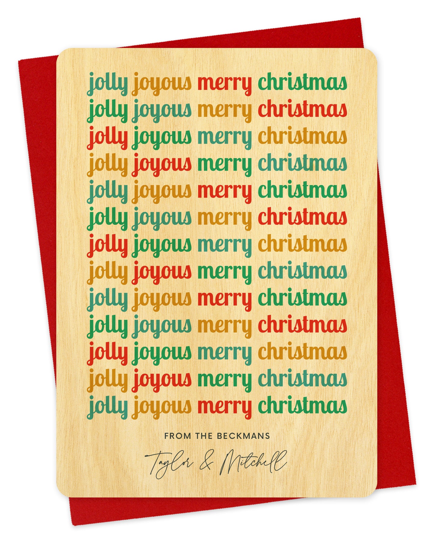Customizable birch wood holiday card featuring cheerful, multicolored “Jolly Joyous Merry Christmas” text repeated down the length of the card and a personal greeting at the bottom. Shown with a red envelope.