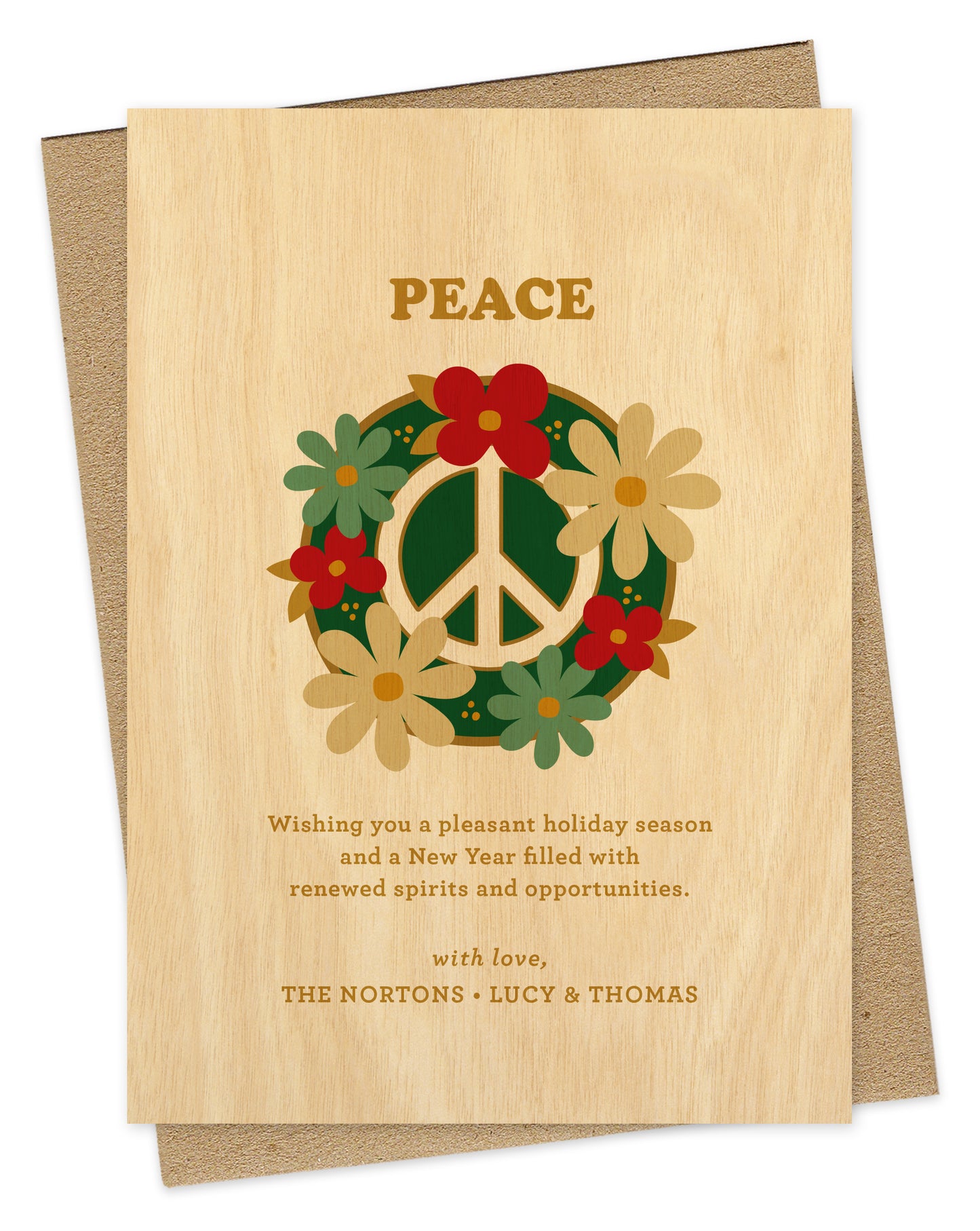 Customizable paper holiday card with a printed birch wood grain background. Card design features a peace sign surrounded by colorful flowers with “Peace” text at the top and a personal greeting at the bottom. Shown with a kraft envelope.