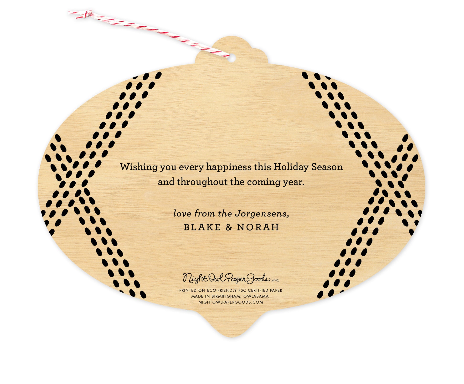 Back of customizable bulb-shaped paper holiday card ornament with Text Back option, showing a personal greeting bordered by black speckled lines on a printed birch wood background.