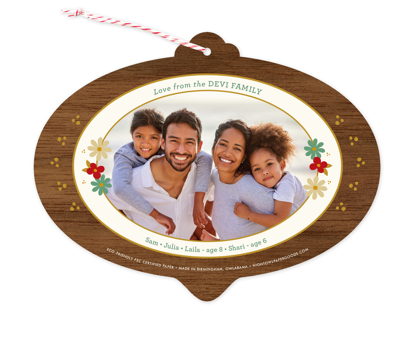Back of customizable bulb-shaped paper holiday ornament card with Photo + Text Back option showing a personal photo and message accented by several small flowers and a printed walnut wood grain border.