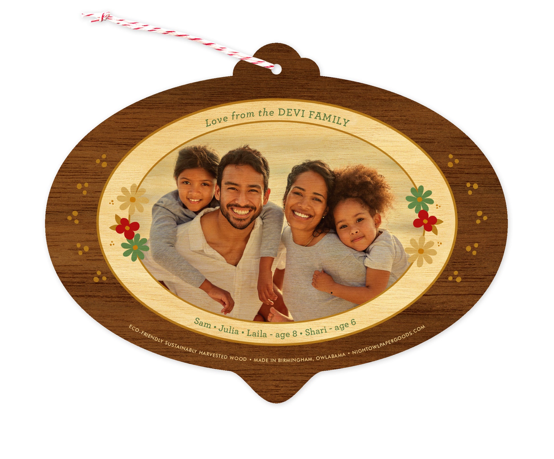 Back of customizable bulb-shaped wood holiday ornament card with Photo + Text Back option showing a personal photo and message accented by several small flowers and a printed walnut wood grain border.