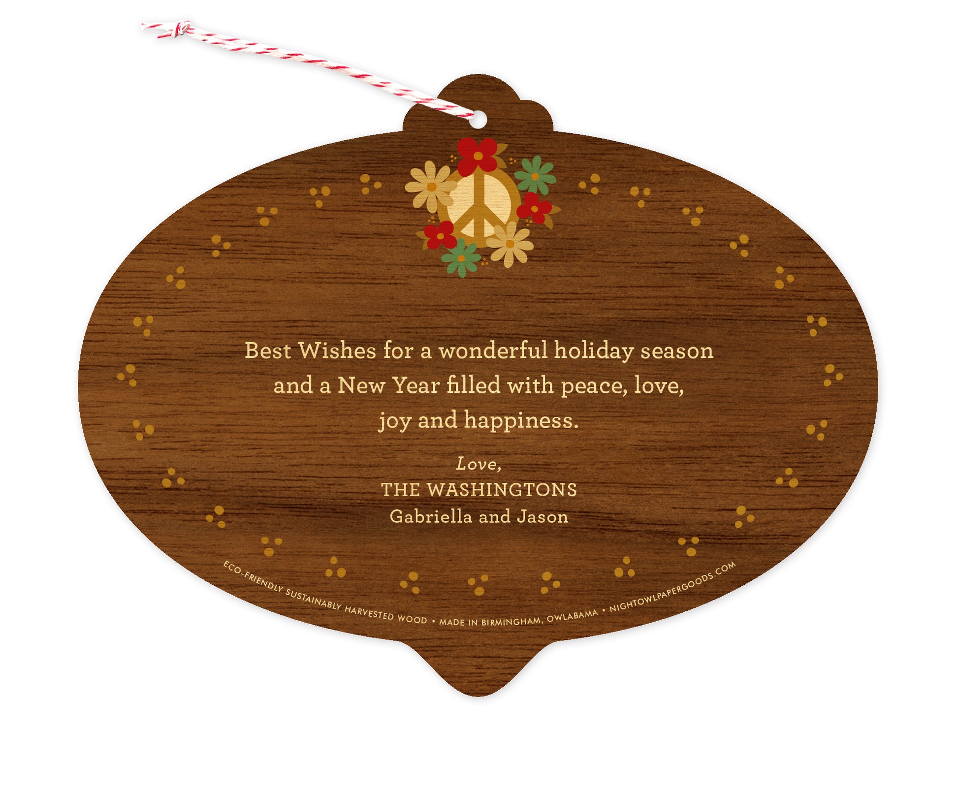 Back of customizable bulb-shaped wood holiday ornament card with Text Back option showing a personal message accented by several small flowers on a printed walnut wood grain background.
