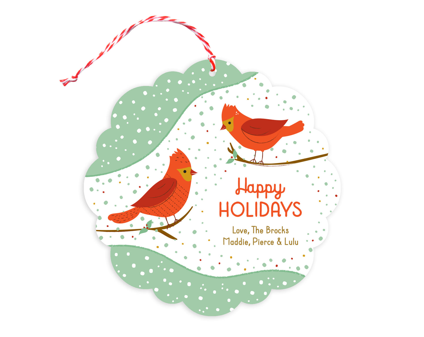 Front of customizable paper holiday ornament card featuring a pair of red birds perched on branches, "Happy Holidays" text, a personal message and a snowy backdrop. Round ornament with scalloped edges.