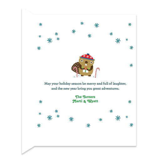 Inside of folded holiday card with coordinating snowflake and festive beaver design and a personal greeting.