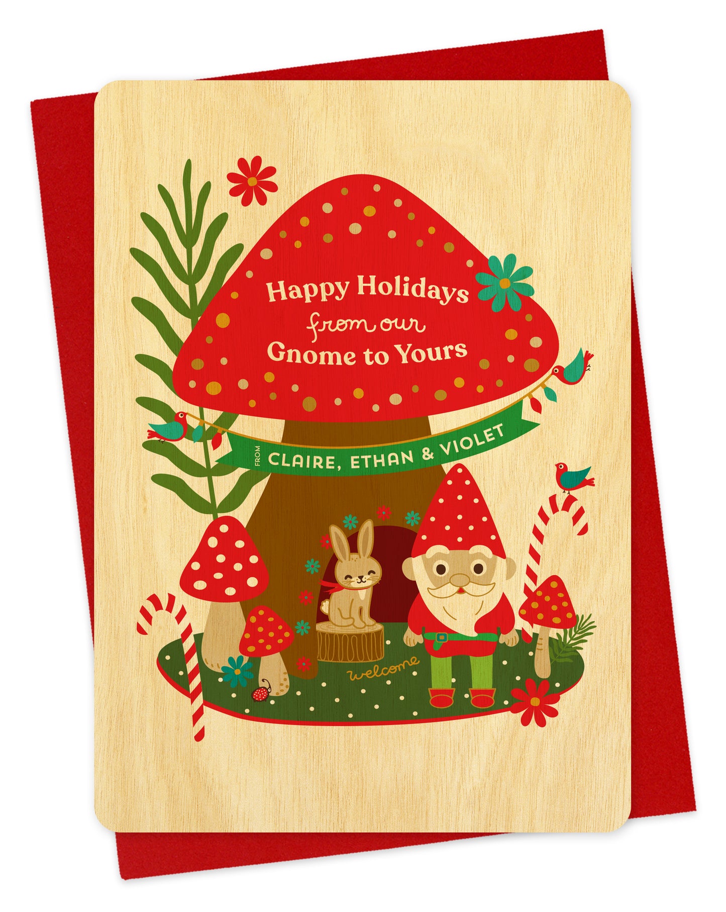 Customizable wood holiday card with a woodland gnome, mushrooms and rabbit illustration and 'Happy Holidays from our Gnome to Yours' text on a red envelope.